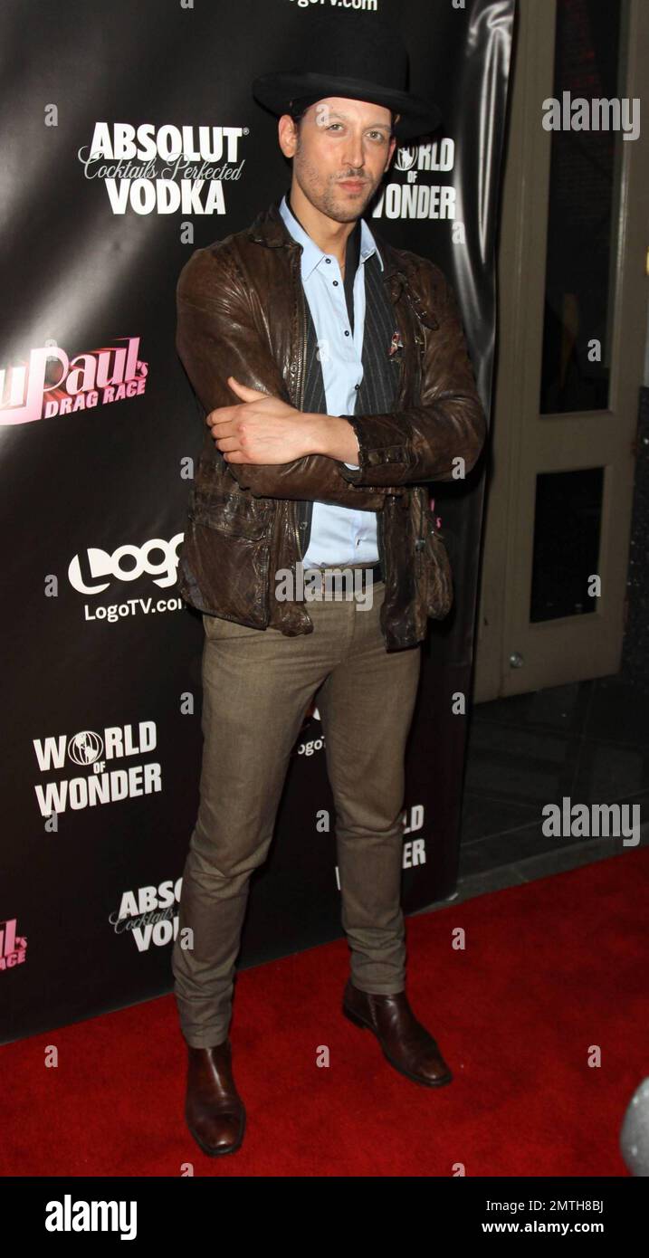 Fashion designer Santino Rice poses for photographers on the red carpet at Rage Nightclub