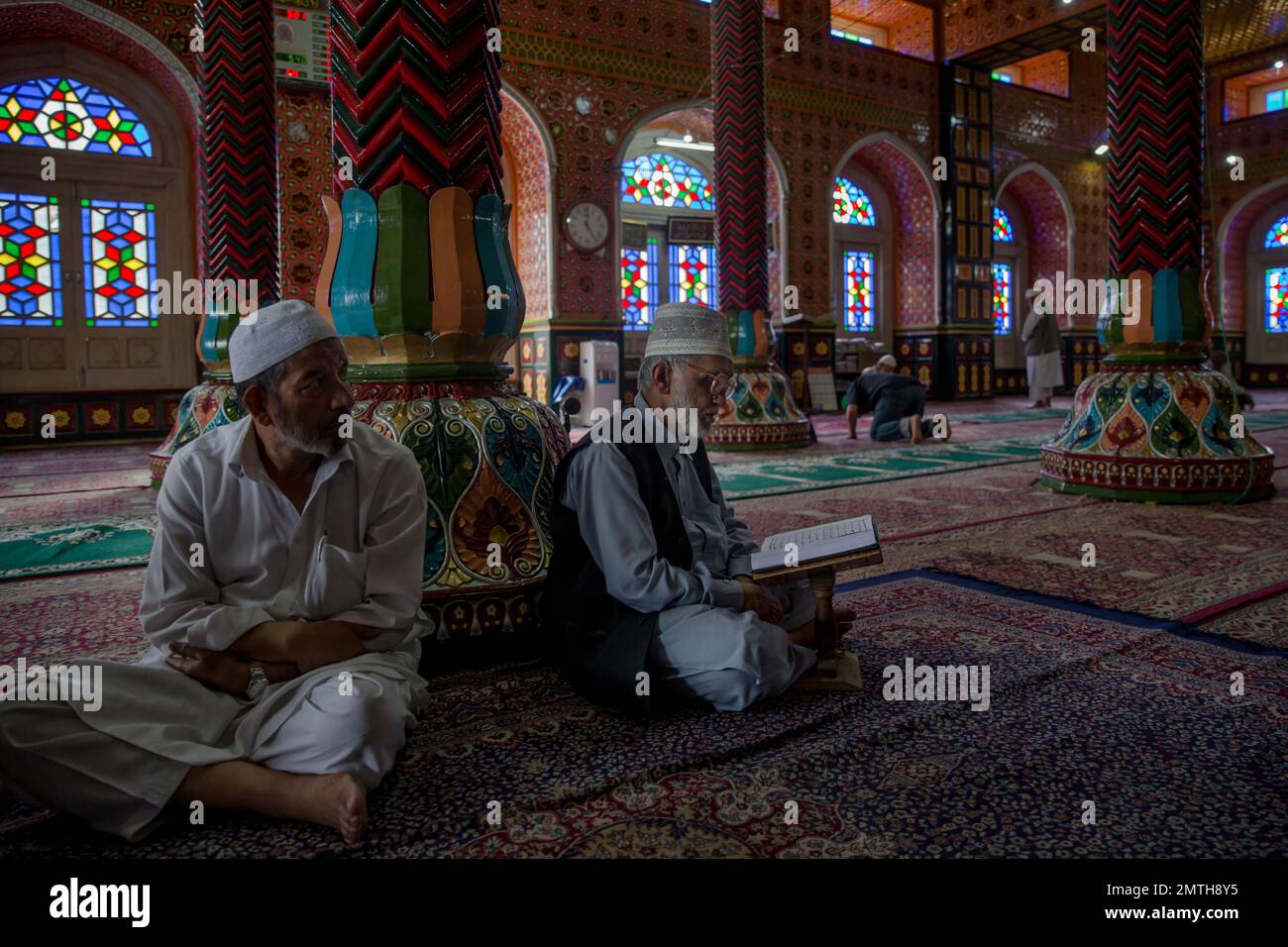 Elderly Kashmiri men read verses from the Quran, Islam's holy book ...