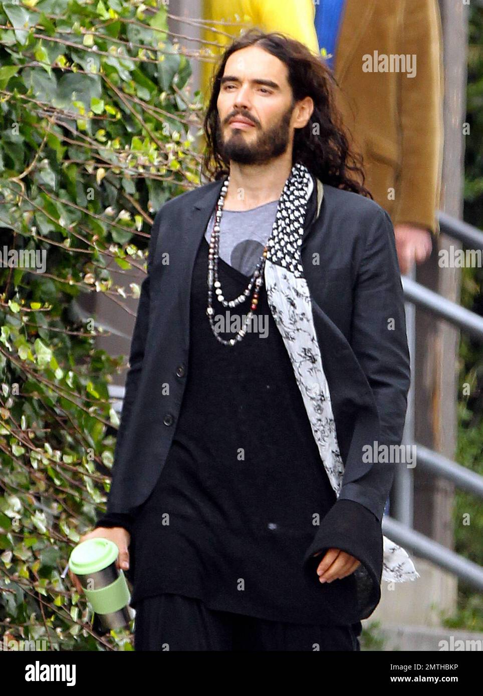 EXCLUSIVE!! Wearing quite the interesting outfit and carrying a travel