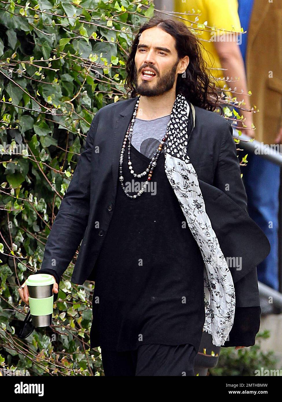 EXCLUSIVE!! Wearing quite the interesting outfit and carrying a travel