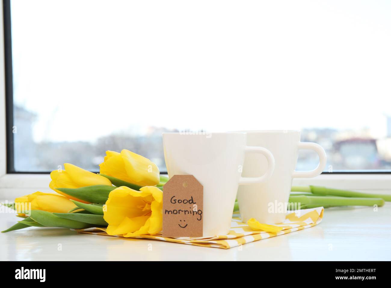 Violet cup of morning coffee or cappuccino and delicate purple, lilac  flowers. Mother's day concept. Cozy breakfast Stock Photo - Alamy