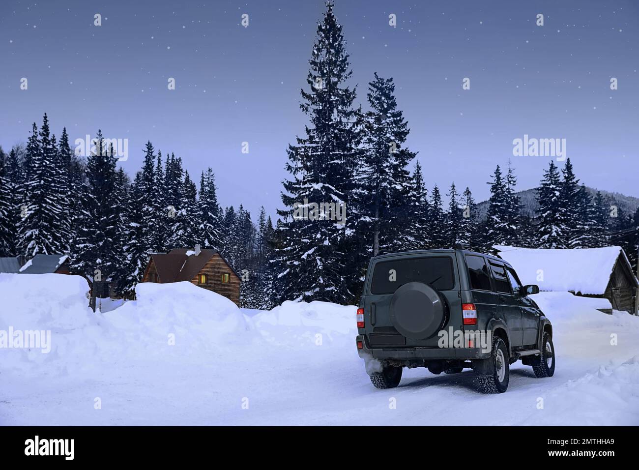Modern car on snowy road. Winter vacation Stock Photo - Alamy