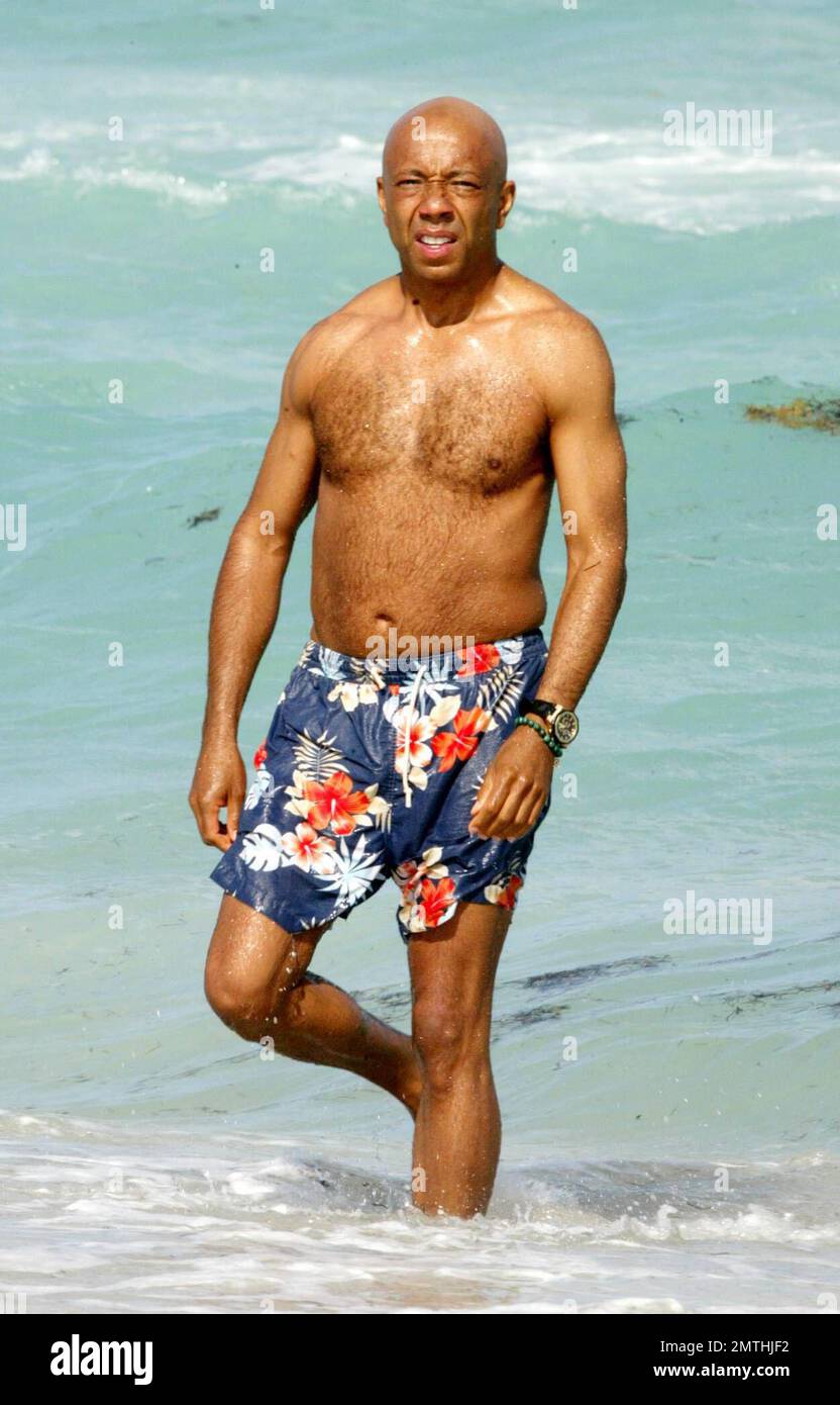 Exclusive Rap mogul Russell Simmons starts the day with a yoga workout and a dip in the ocean Maimi Beach FL 3 15 07. All Stock Photo Alamy