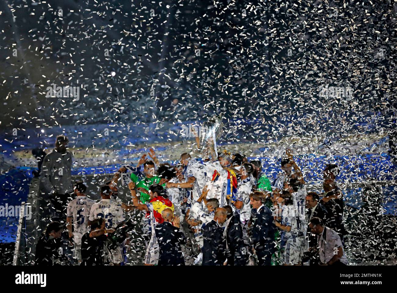 Real Madrid players celebrate with their trophy after winning the ...