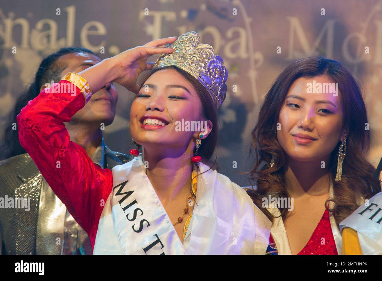 Tenzin Paldon, 21, reacts after winning the 2017 Miss Tibet beauty pageant at the Tibetan Institute of Performing Arts in Dharmsala, India, Sunday, June 4, 2017. Paldon, who lives in the Indian state of Karnataka, was declared winner among nine contestants. (AP Photo/Ashwini Bhatia) Stock Photo