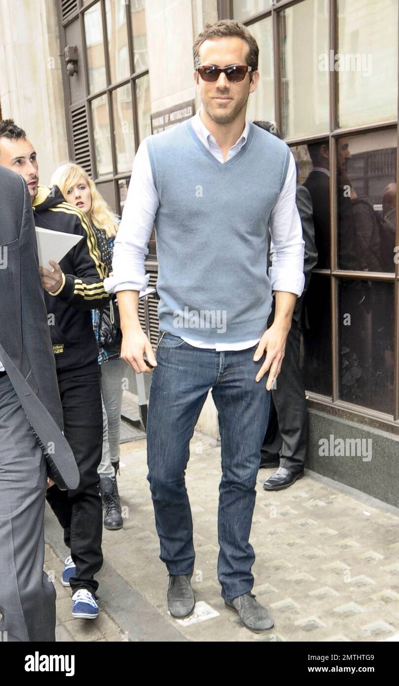 Green Lantern" star Ryan Reynolds wears a sweater vest and jeans as he  leaves BBC Radio 1 in London, UK. 6/10/11 Stock Photo - Alamy