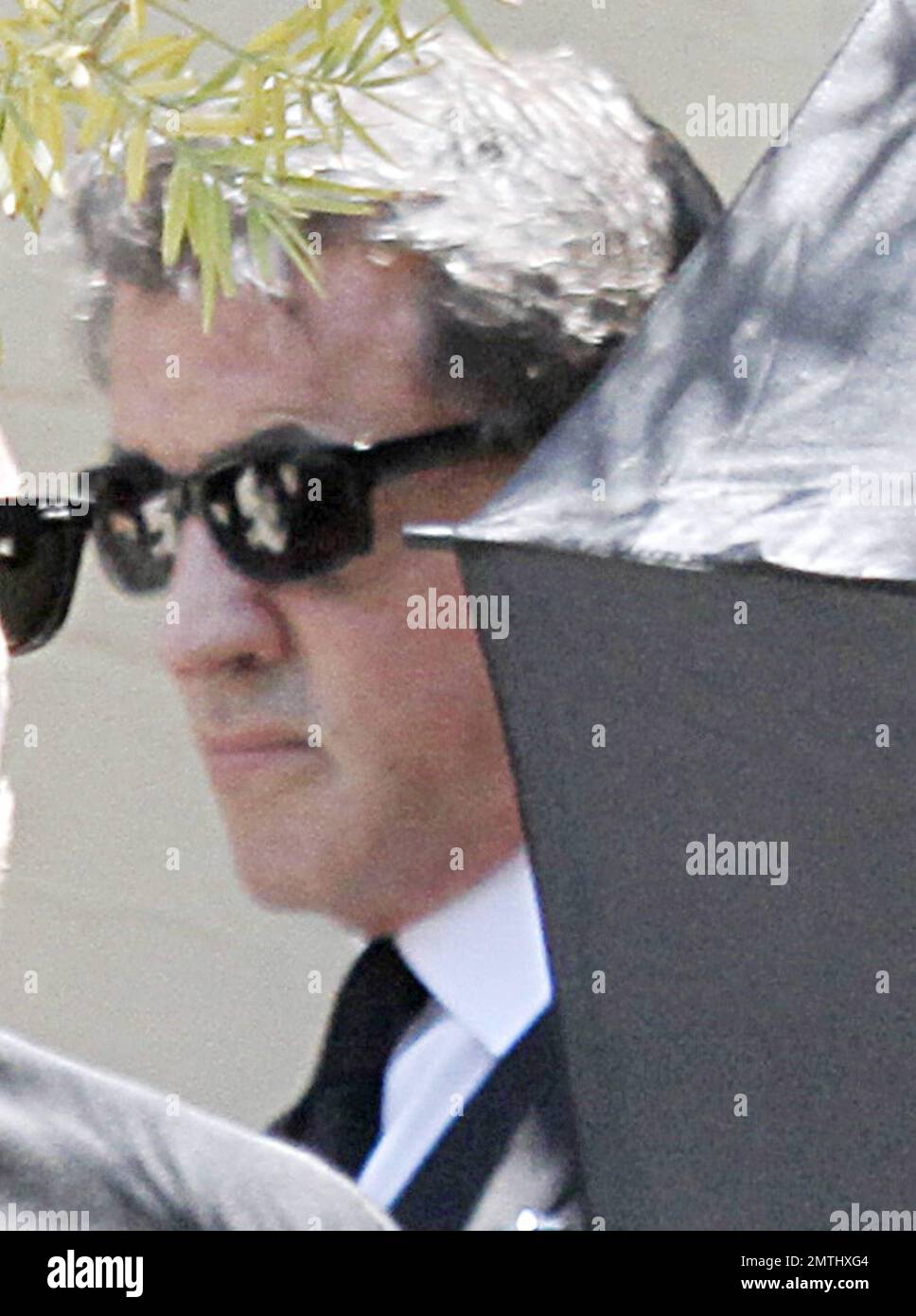 Sylvester Stallone arrives at his son Sage Stallone's funeral. Wearing a black suit and shades to hide his eyes, the actor made his way into the St. Martin of Tours Catholic Church. Sage was found dead at his LA home on the 13th July, the cause of death is yet to be confirmed. Brentwood, CA, 21st of July, 2012.   . Stock Photo