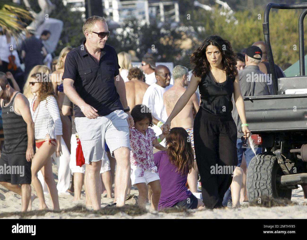 EXCLUSIVE!! Actress Salma Hayek, husband Francois-Henri Pinault and  daughter Valentina end their Fourth of July holiday with a family walk on  the beach. Malibu, CA. 7/4/11 Stock Photo - Alamy