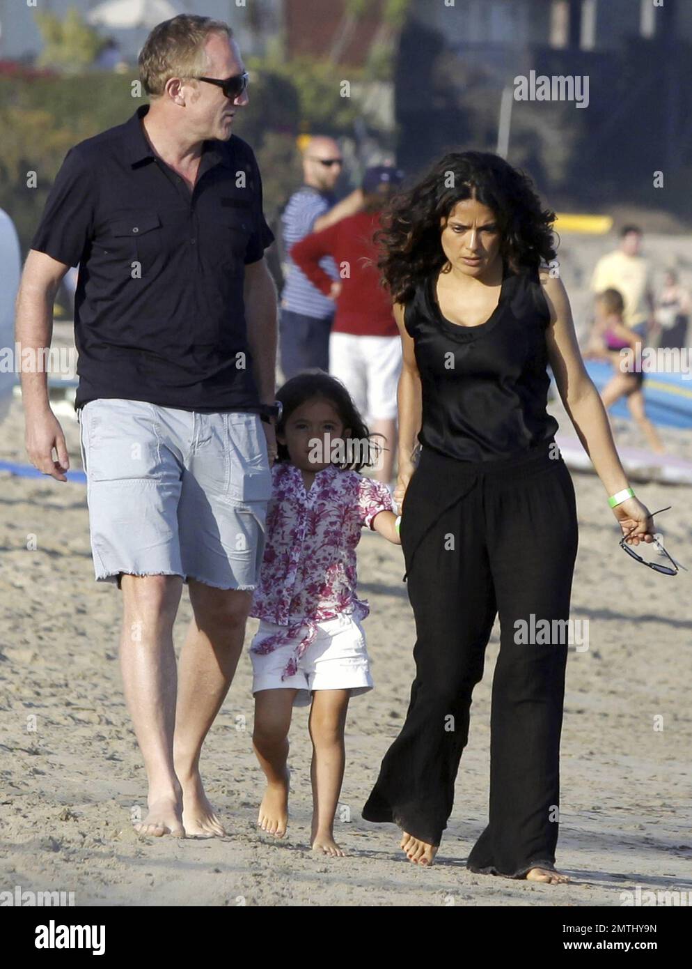 EXCLUSIVE!! Actress Salma Hayek, husband Francois-Henri Pinault and  daughter Valentina end their Fourth of July holiday with a family walk on  the beach. Malibu, CA. 7/4/11 Stock Photo - Alamy