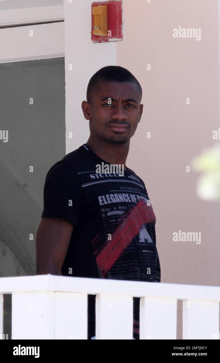 Chelsea forward Salomon Kalou shares a kiss with his girlfriend at his beachfront hotel and playfully pokes his tongue out as she walks off.  The couple later swam and frolicked in the warm Ocean.   Miami Beach, FL 6/30/2010 . Stock Photo