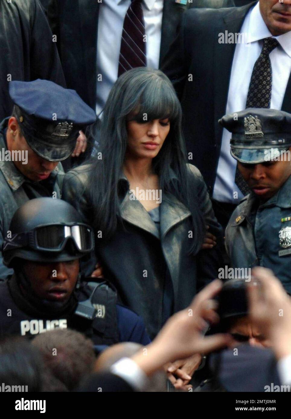 Actress Angelina Jolie and actor Liev Schreiber film a scene on the set