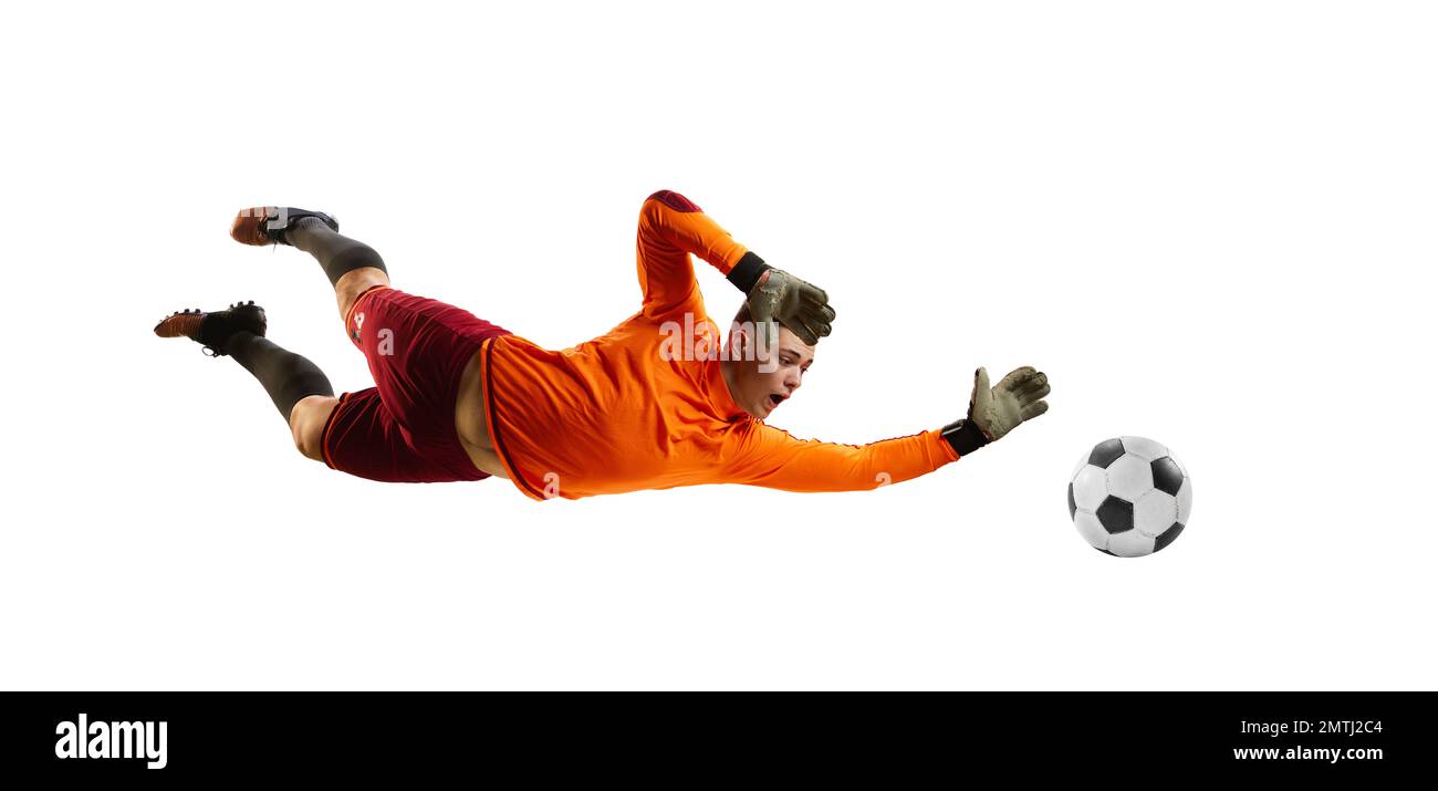 Young man, soccer football goalkeeper catches ball in jump isolated