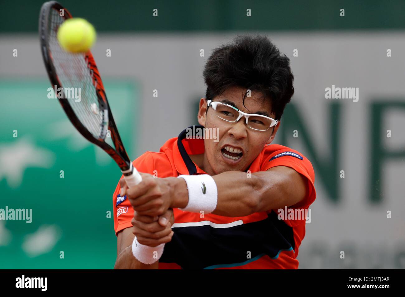 Korea's Hyeon Chung plays a shot against Japan's Kei Nishikori during their  third round match of the French Open tennis tournament at the Roland Garros  stadium, in Paris, France. Saturday, June 3,