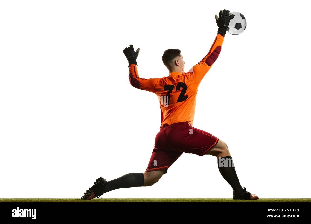 Professional soccer football goalkeeper in action, motion isolated over