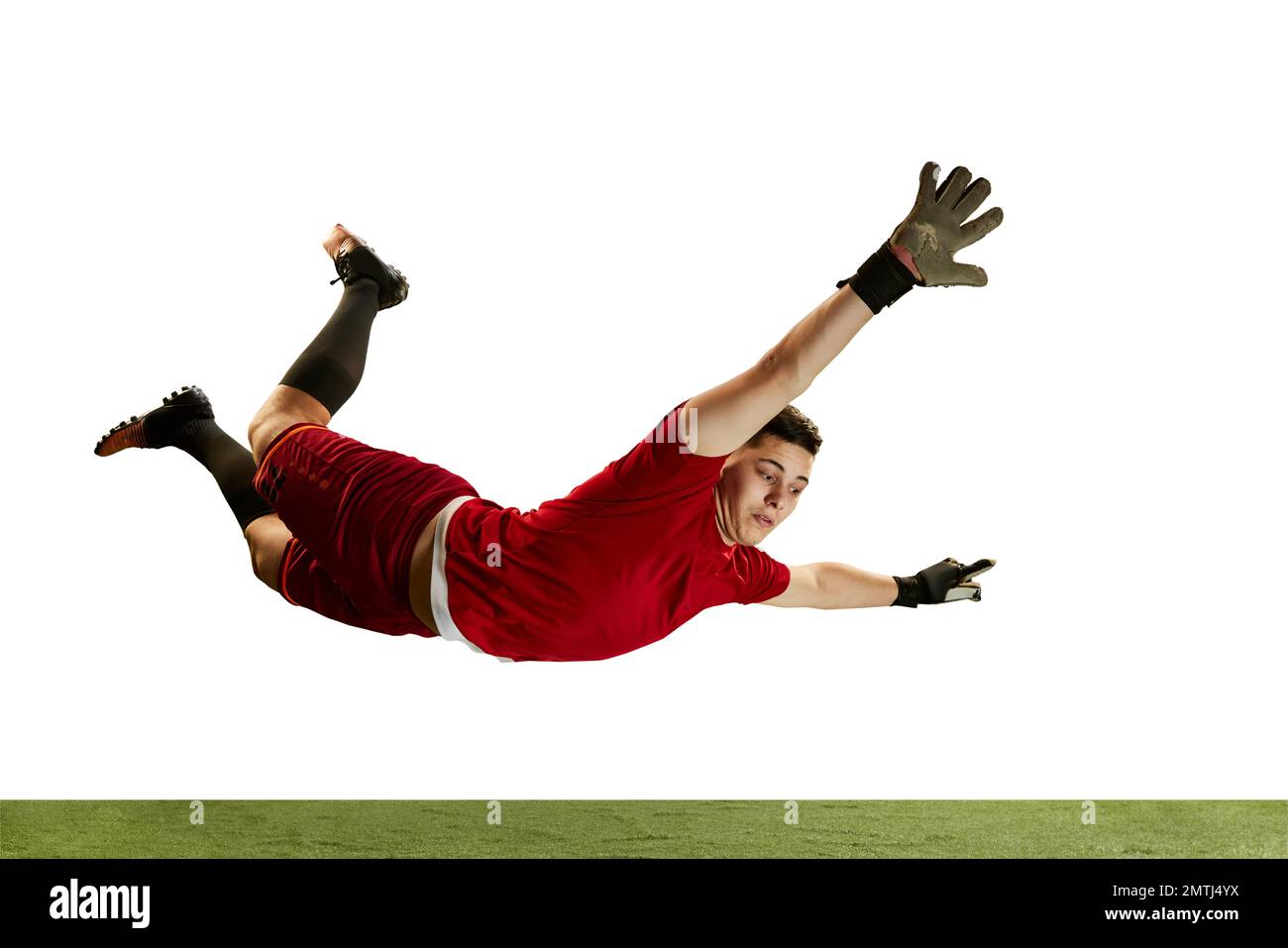 Professional soccer football goalkeeper in action, motion isolated over