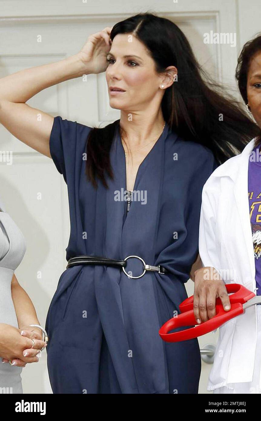 Actress Sandra Bullock smiles during a ribbon-cutting ceremony opening the new Warren Easton Charter High School-based health clinic in New Orleans, a full-service medical and dental facility, on the fifth anniversary of Hurricane Katrina.  After attending the ceremony with New Orleans Mayor Mitch Landrieu and others, Bullock made a speech and utilized little props during a press conference in the school's auditorium where she appeared very happy.  Bullock, whose divorce from husband Jesse James was finalized in June, lives in New Orleans with her eight-month-old adopted son Louis Bardo Bulloc Stock Photo