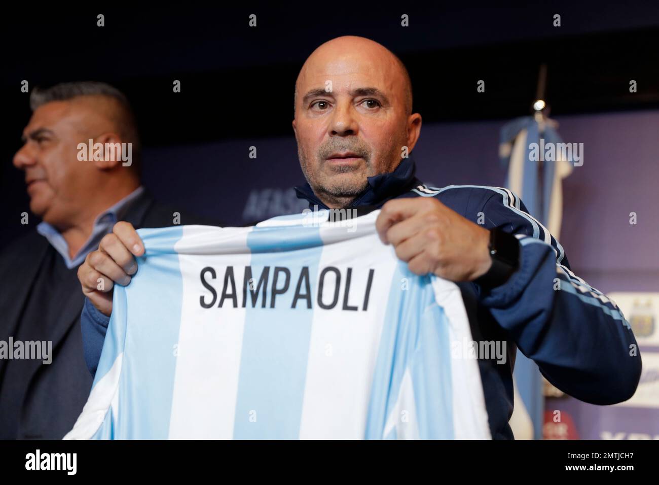 Argentina's new soccer coach Jorge Sampaoli holds up a jersey featuring his  name at the end of a press conference in Buenos Aires, Argentina, Thursday,  June 1, 2017. (AP Photo/Natacha Pisarenko Stock
