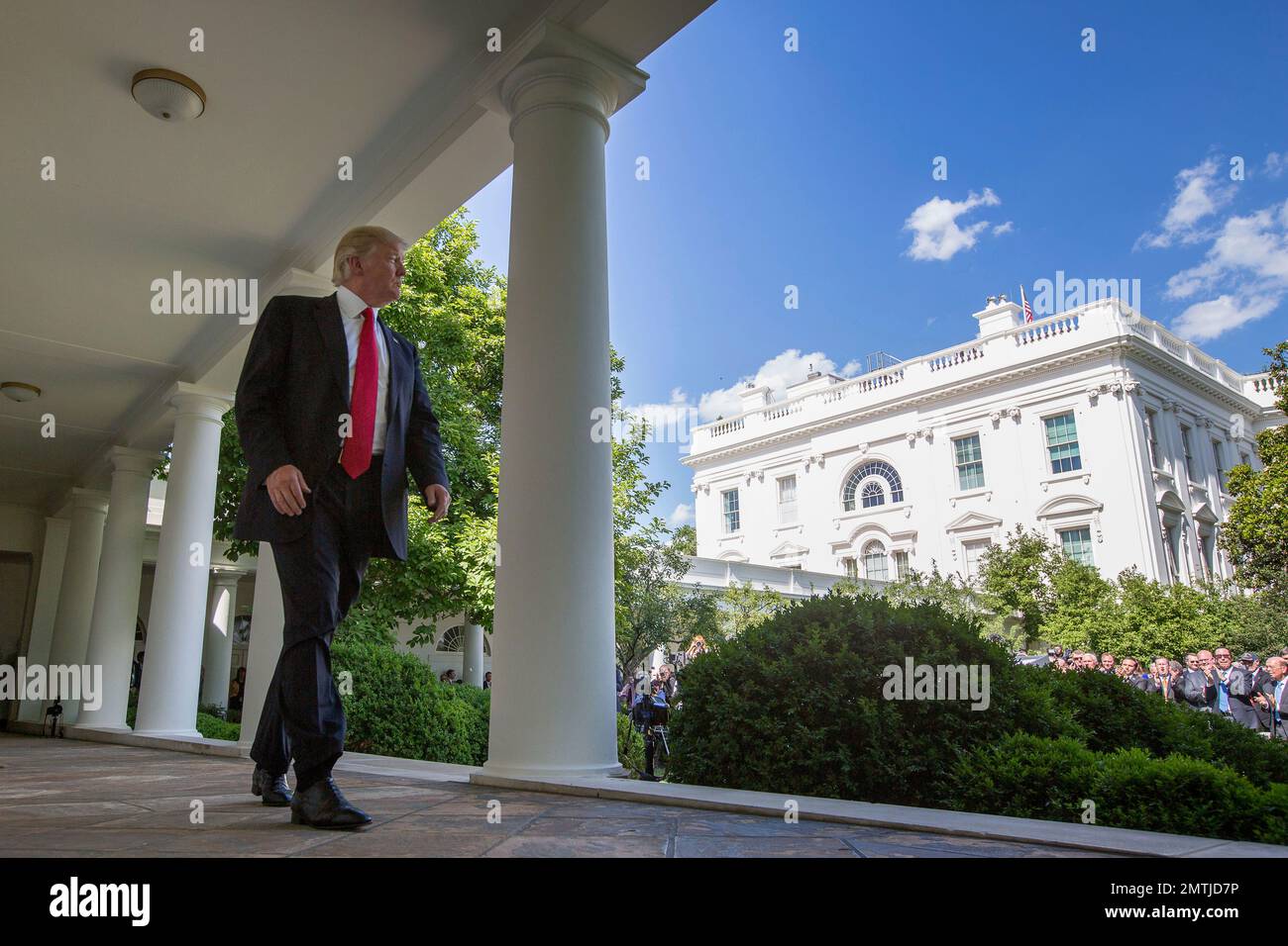 President Donald Trump walks to the Oval Office of the White House in ...