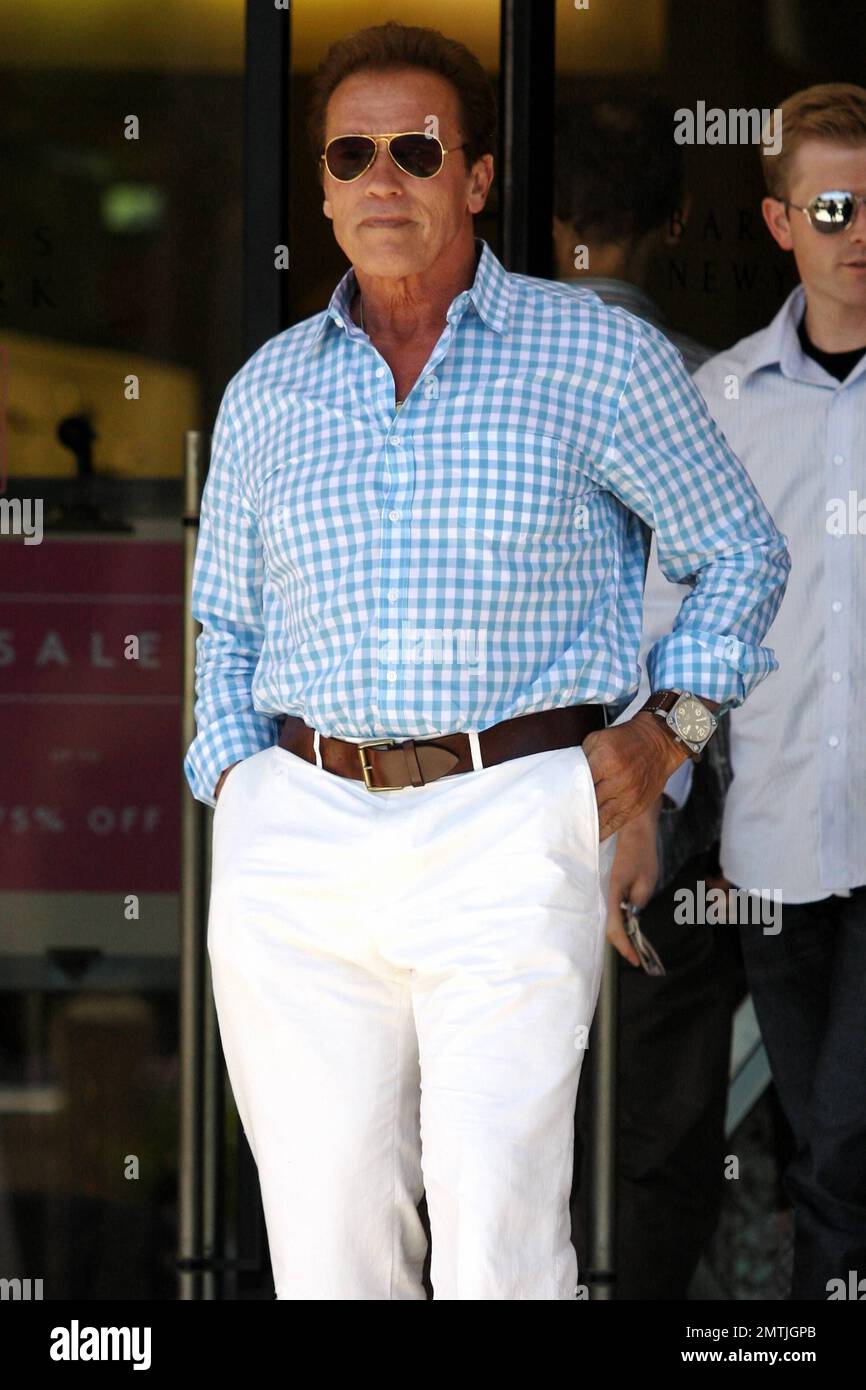 Actor and former California Governor Arnold Schwarzenegger looks preppy in white pants and a