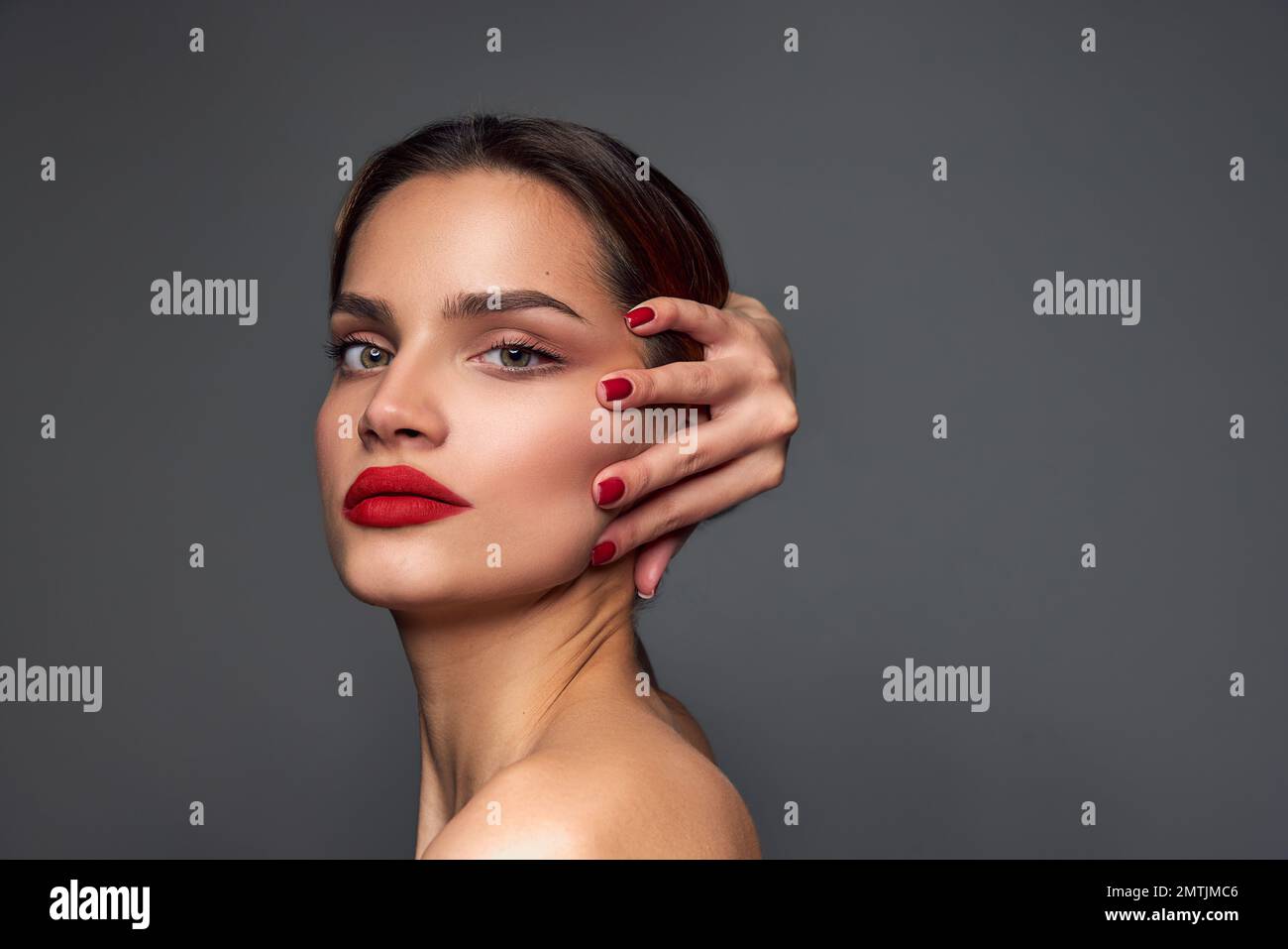 Self-acceptance. Beautiful young girl with smooth well-kept, red lips 