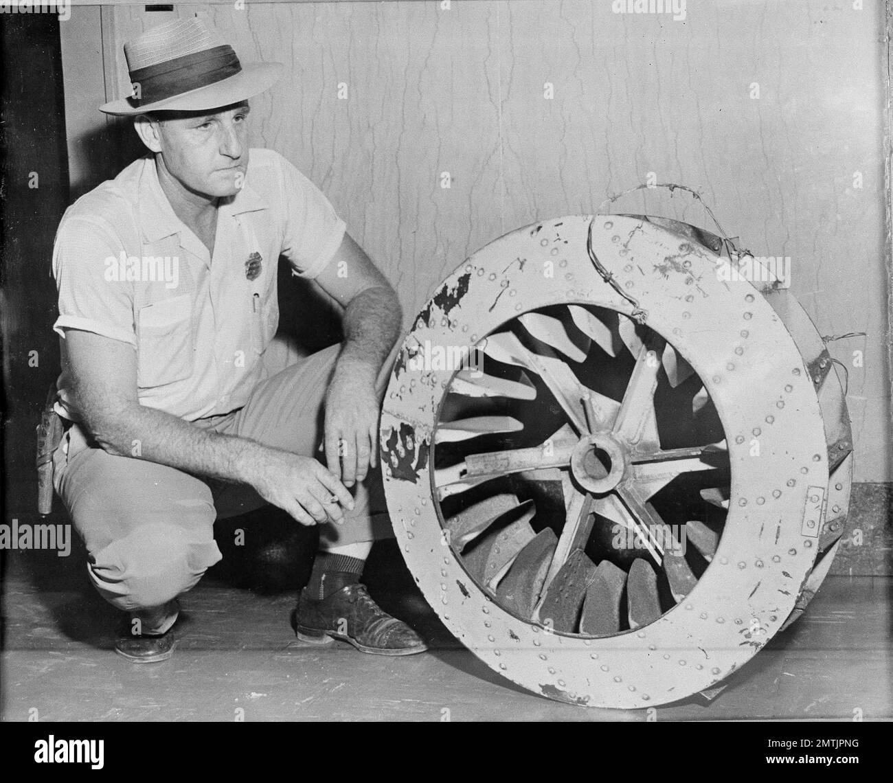 Leflore County Deputy Sheriff John Ed Cothran examines the huge cotton