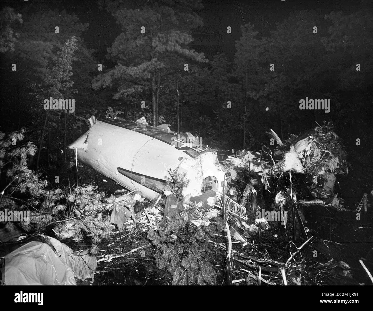 Soldiers examine the largest piece of fuselage of the Londonbound Air