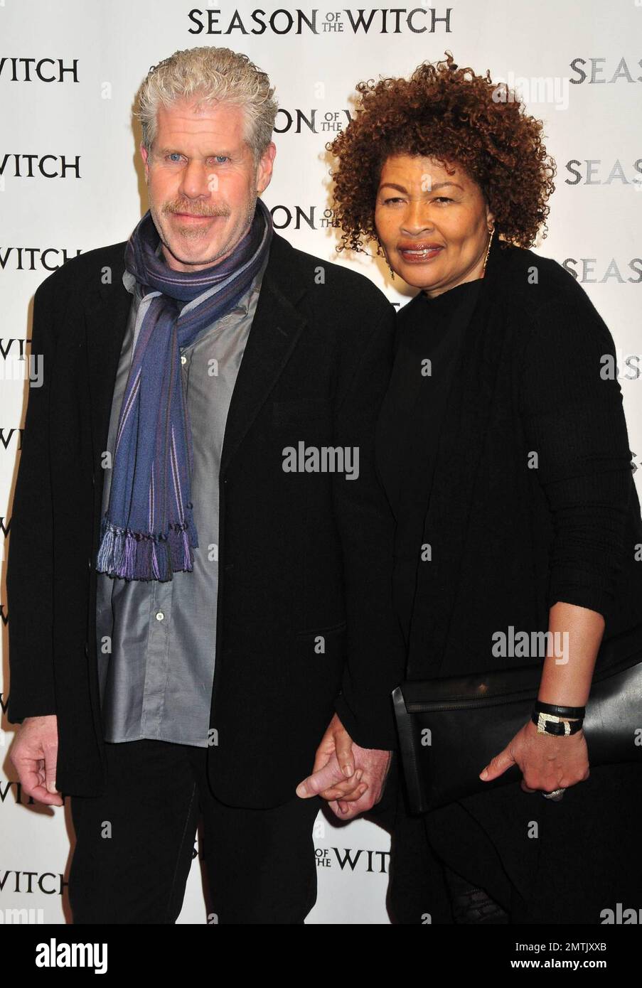 Ron Perlman wife Opal Stone pose for photographers on the red carpet at