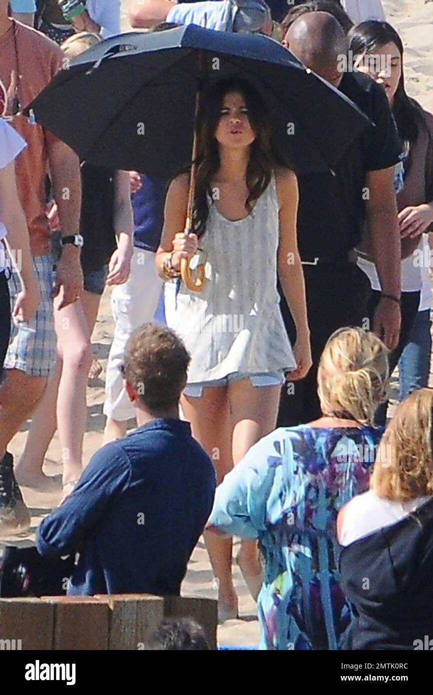 Before heading to the Grammy Awards pop singer Selena Gomez filmed part of  a music video on the beach with a throng of other girls. Gomez, 18,  appeared to get a bit