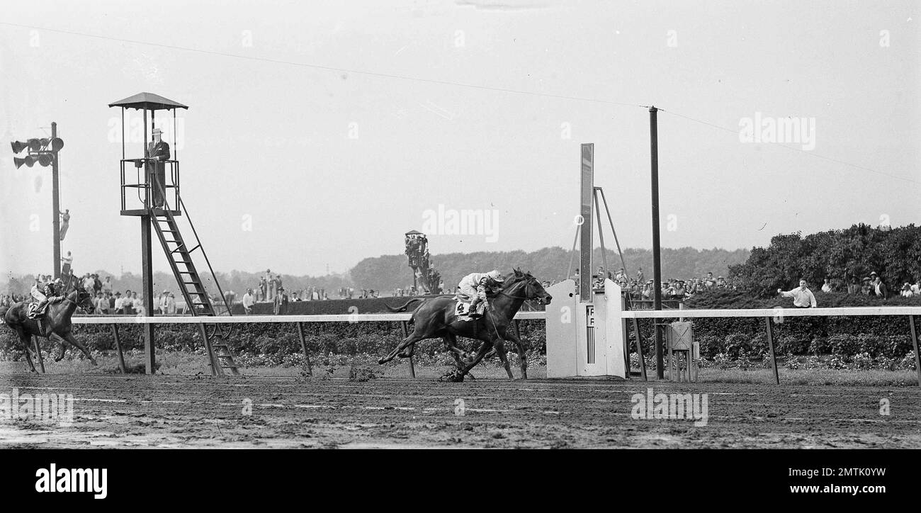 Stymie, foreground, with jockey Conn McCreary up, leads Natchez, with