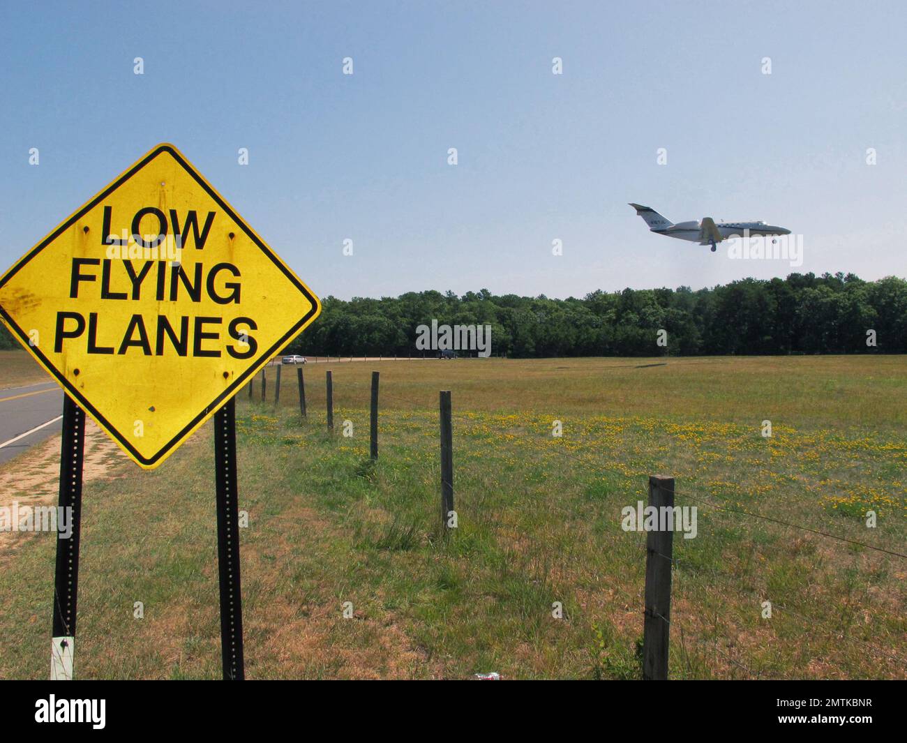 FILE In this Aug. 20, 2014, file photo, a small jet approaches the runway at East Hampton Town