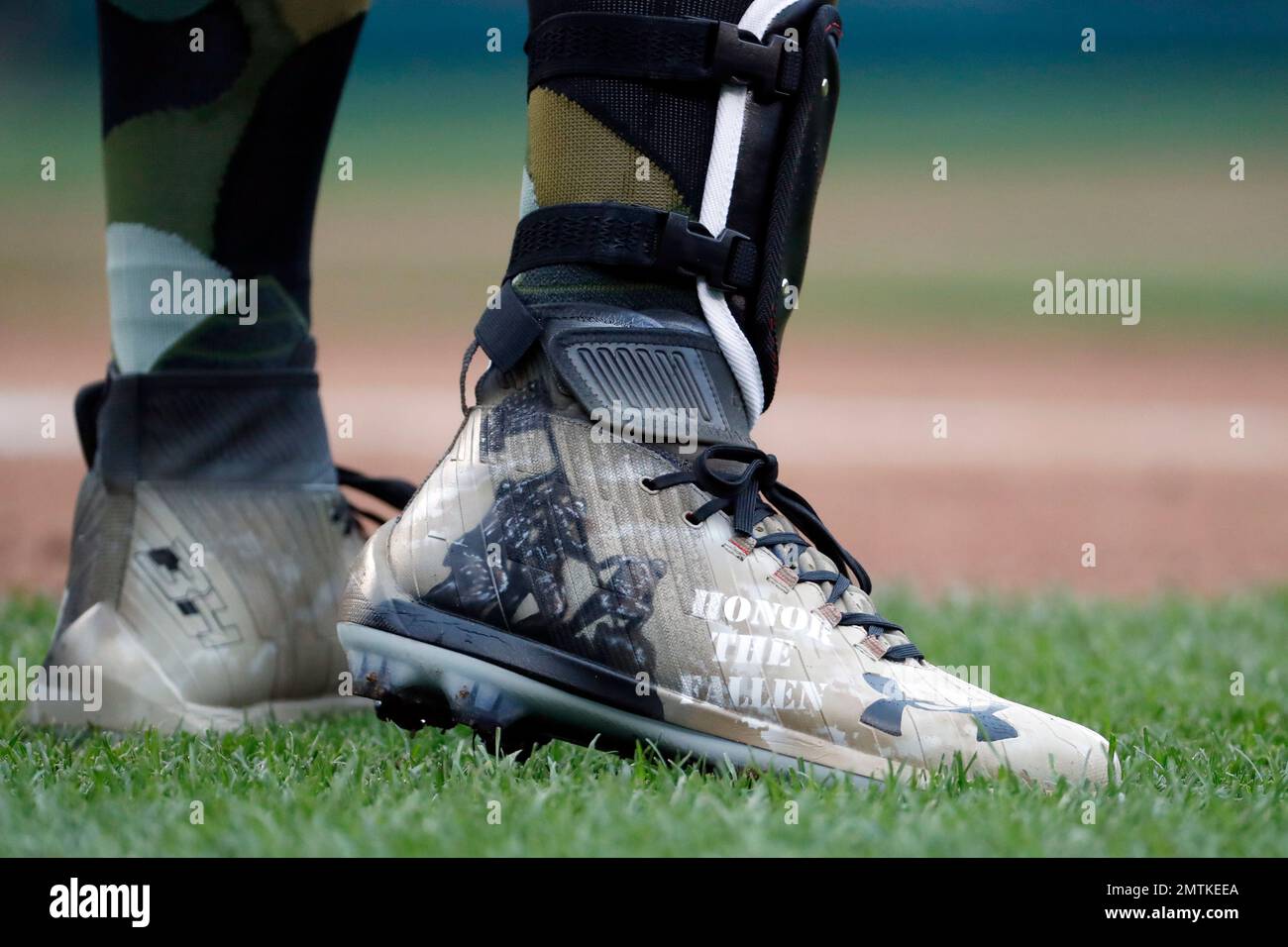 Washington Nationals Bryce Harper wears cleats with a Memorial