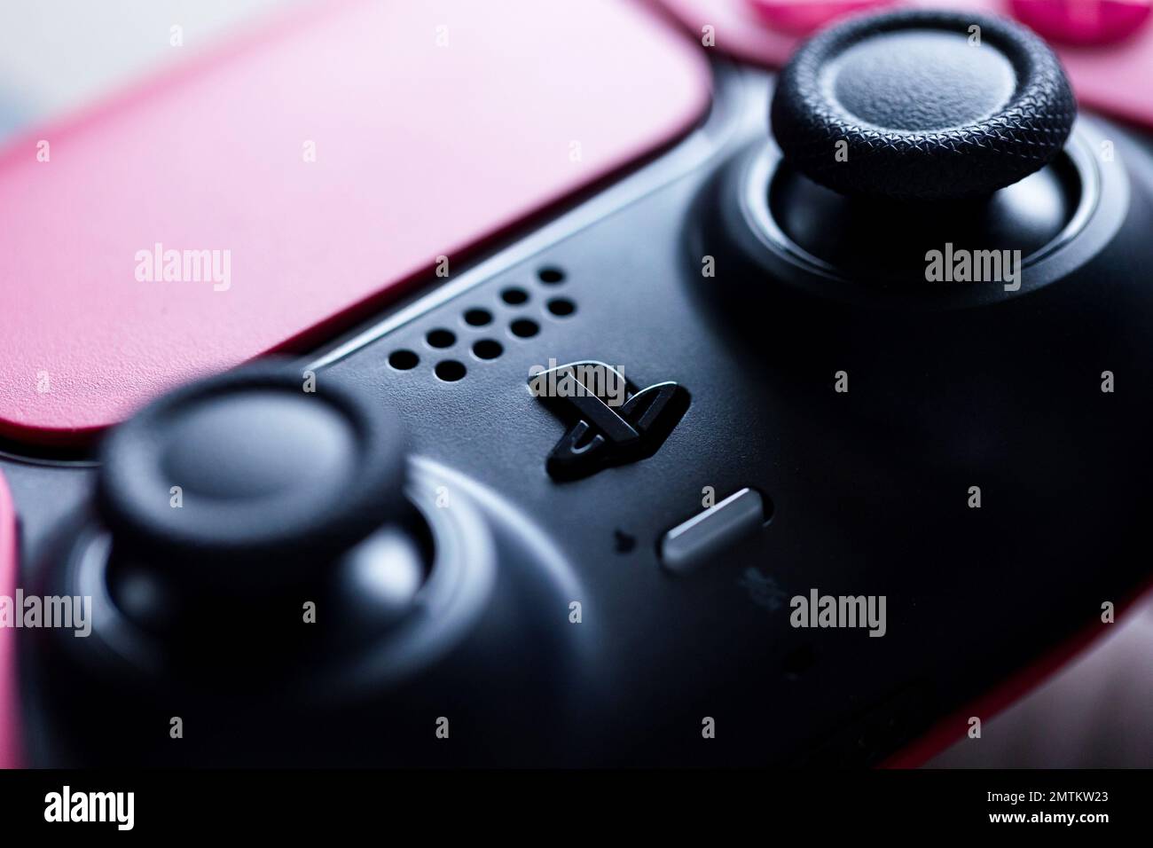 Brecht, Belgium - 26 januari 2023: A close up portrait of the logo,  touchpad and joysticks of a sony playstation 5 cosmic red wireless  controller Stock Photo - Alamy