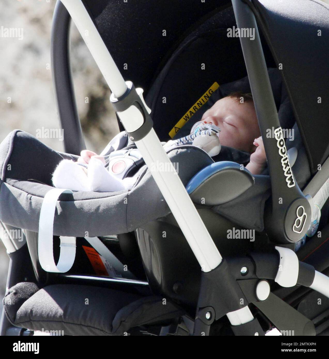 Tennis ace Boris Becker walks along Miami Beach boardwalk with wife  Sharlely and new-born baby son Amadeus in a stroller shielded from the sun.  Sharlely is still showing some baby weight after