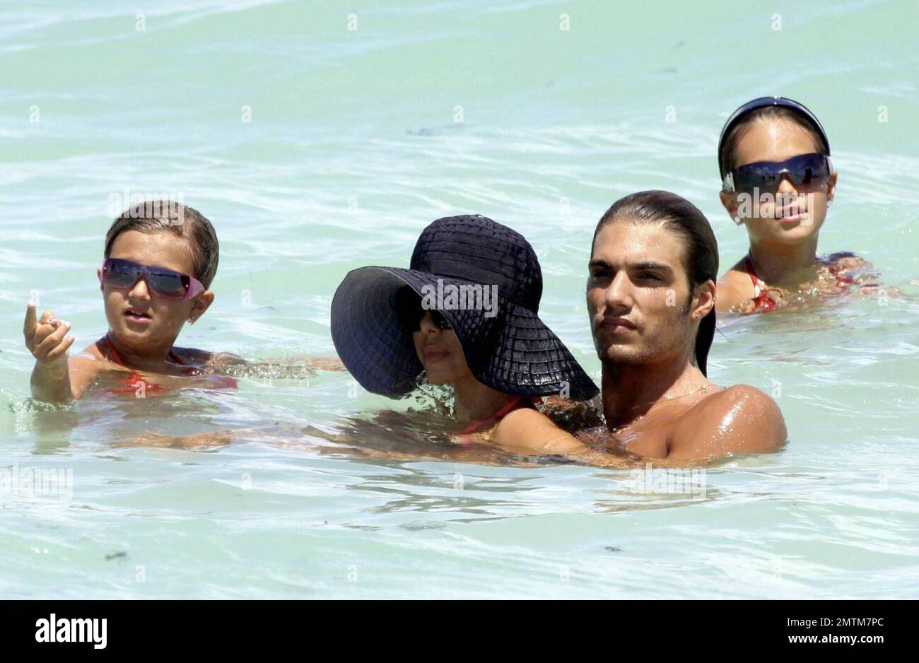 EXCLUSIVE!! Shauna Sand spends the afternoon frolicking in the ocean with her three daughters, Alexandra, Victoria and Isabella, and her young boyfriend. The group lounged on the beach and splashed around in the heavy surf on a beautiful South Florida day in Miami Beach, FL.  8/14/09. Stock Photo