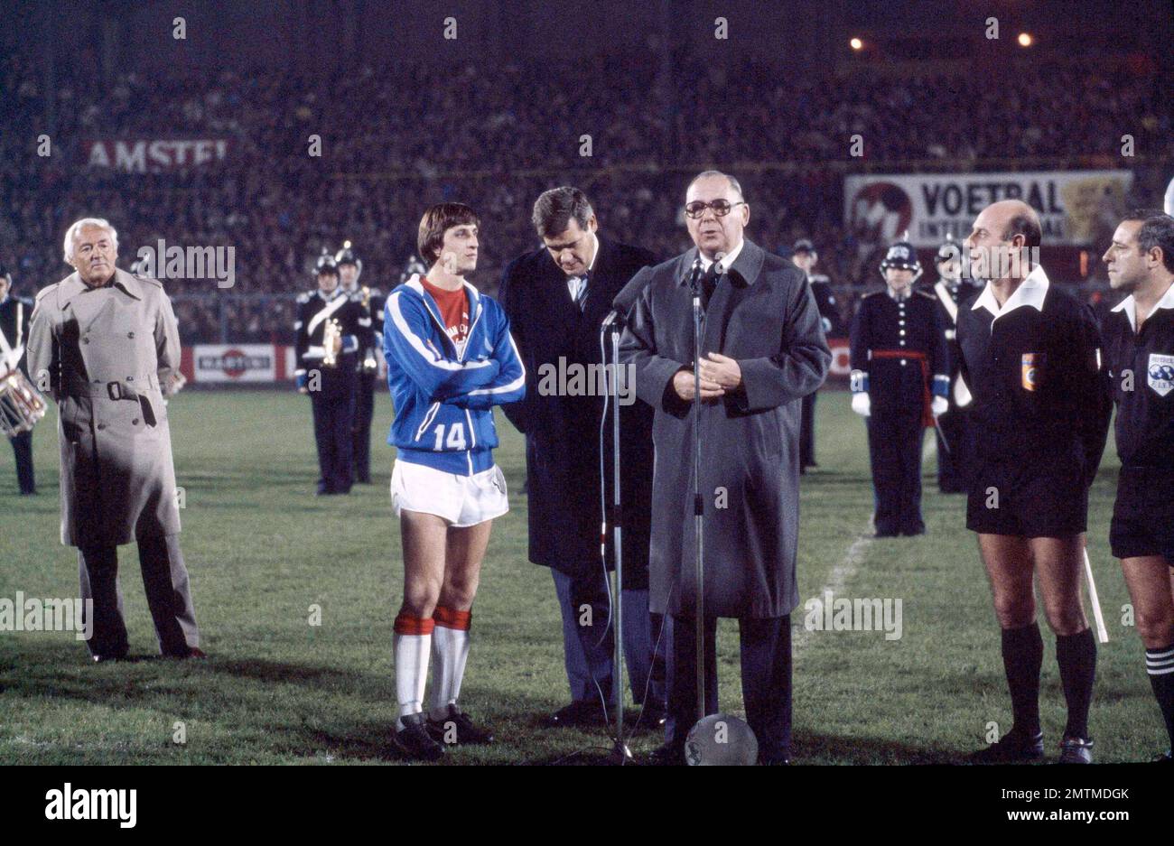 Johan Cruyff, in blue warm-up jacket, returns to his old team Ajax for the  final game of his career at Olympic Stadium in Amsterdam, Nov. 14, 1978.  Others are unidentified. (AP Photo