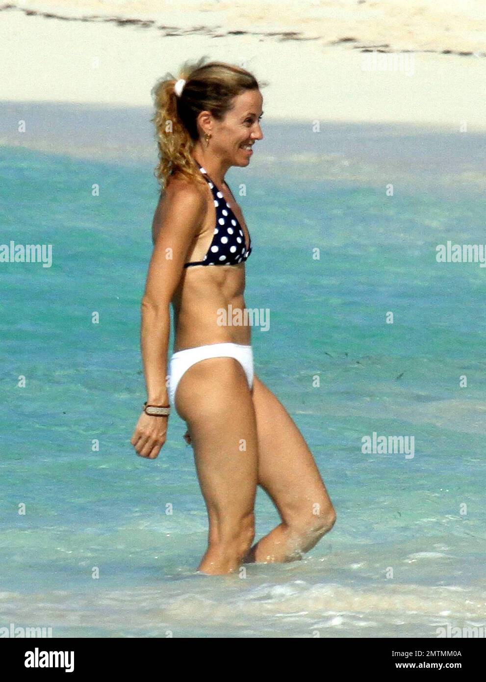 Having been seen earlier in the day in a bright yellow bikini, rocker Sheryl  Crow shows off her figure in a black and white polka-dot bikini while  spending more time on the