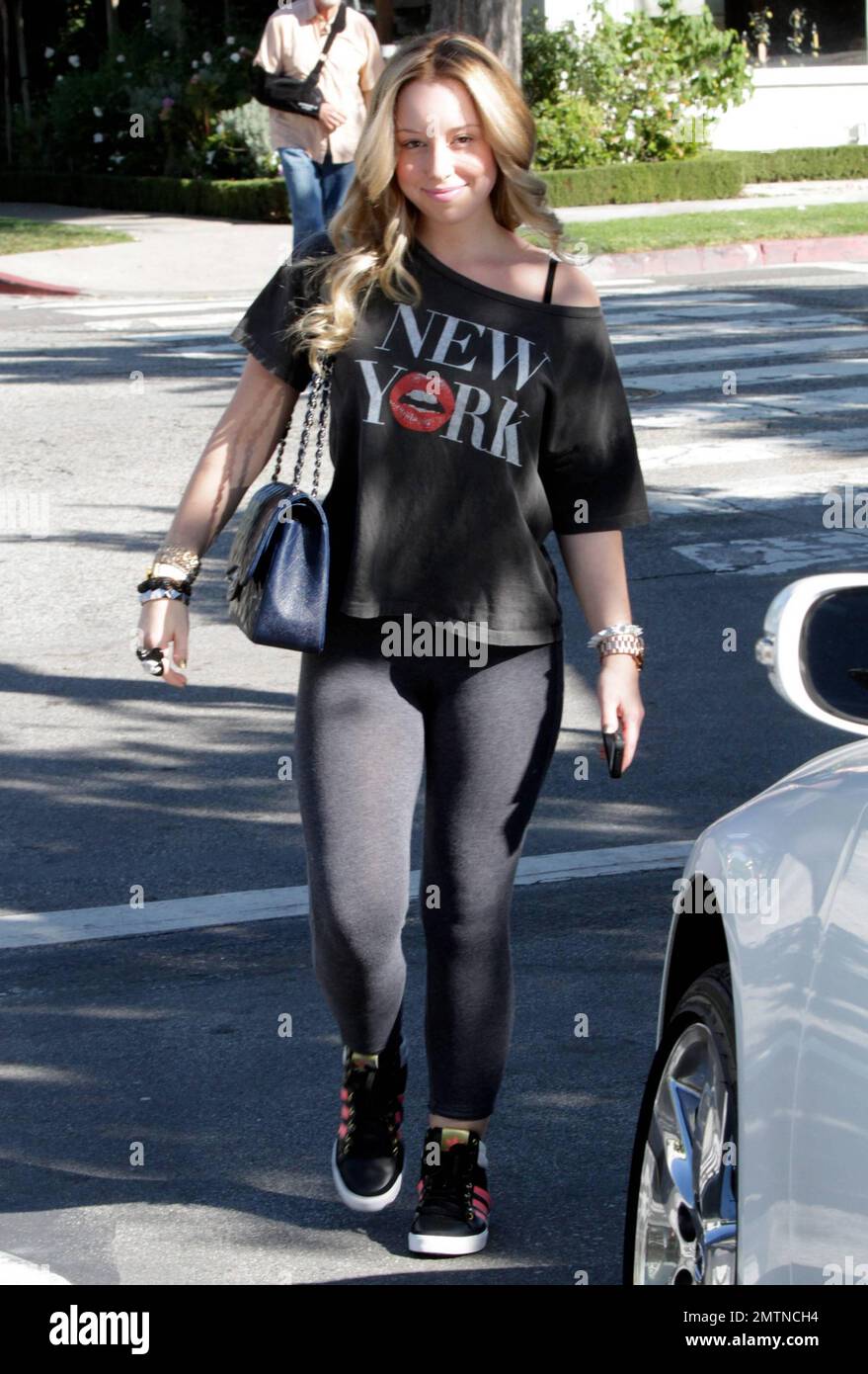 EXCLUSIVE!! - Skyler Shaye, goddaughter to actor Jon Voight, was seen leaving Ken Paves Salon in a black off the shoulder t shirt with New York printed on it, black leggings and paired off with black sneakers. Skyler is best known for her role as Cloe in 'Bratz: The Movie.' Los Angeles, CA. 27th October 2011. Stock Photo