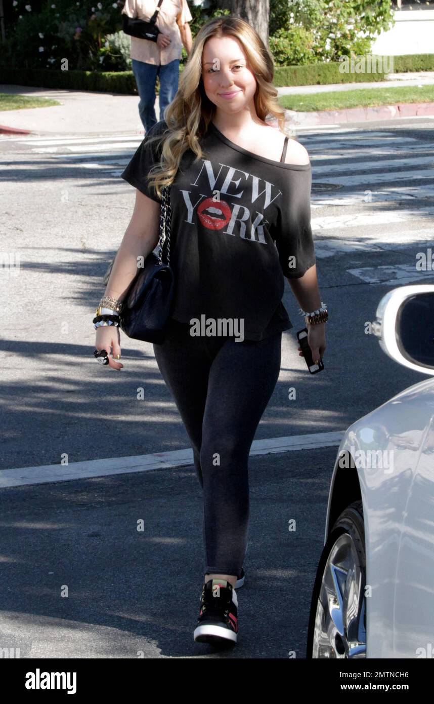 EXCLUSIVE!! - Skyler Shaye, goddaughter to actor Jon Voight, was seen leaving Ken Paves Salon in a black off the shoulder t shirt with New York printed on it, black leggings and paired off with black sneakers. Skyler is best known for her role as Cloe in 'Bratz: The Movie.' Los Angeles, CA. 27th October 2011.   . Stock Photo