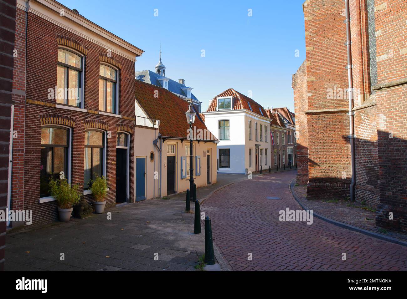 The historic city center of Weesp, a small town located in the East of Amsterdam, North Holland, Netherlands, with historic houses along Kerkstraat Stock Photo
