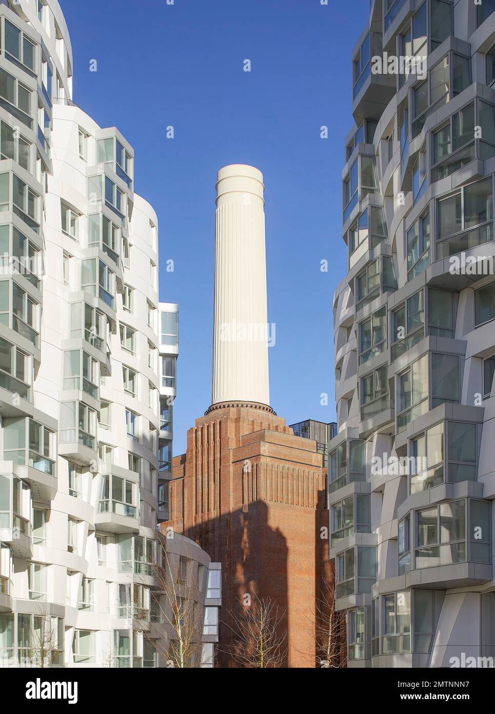 Prospect Place in juxtaposition to iconic Battersea Power Station building. Prospect Place Battersea Power Station Frank Gehry, London, United Kingdom Stock Photo
