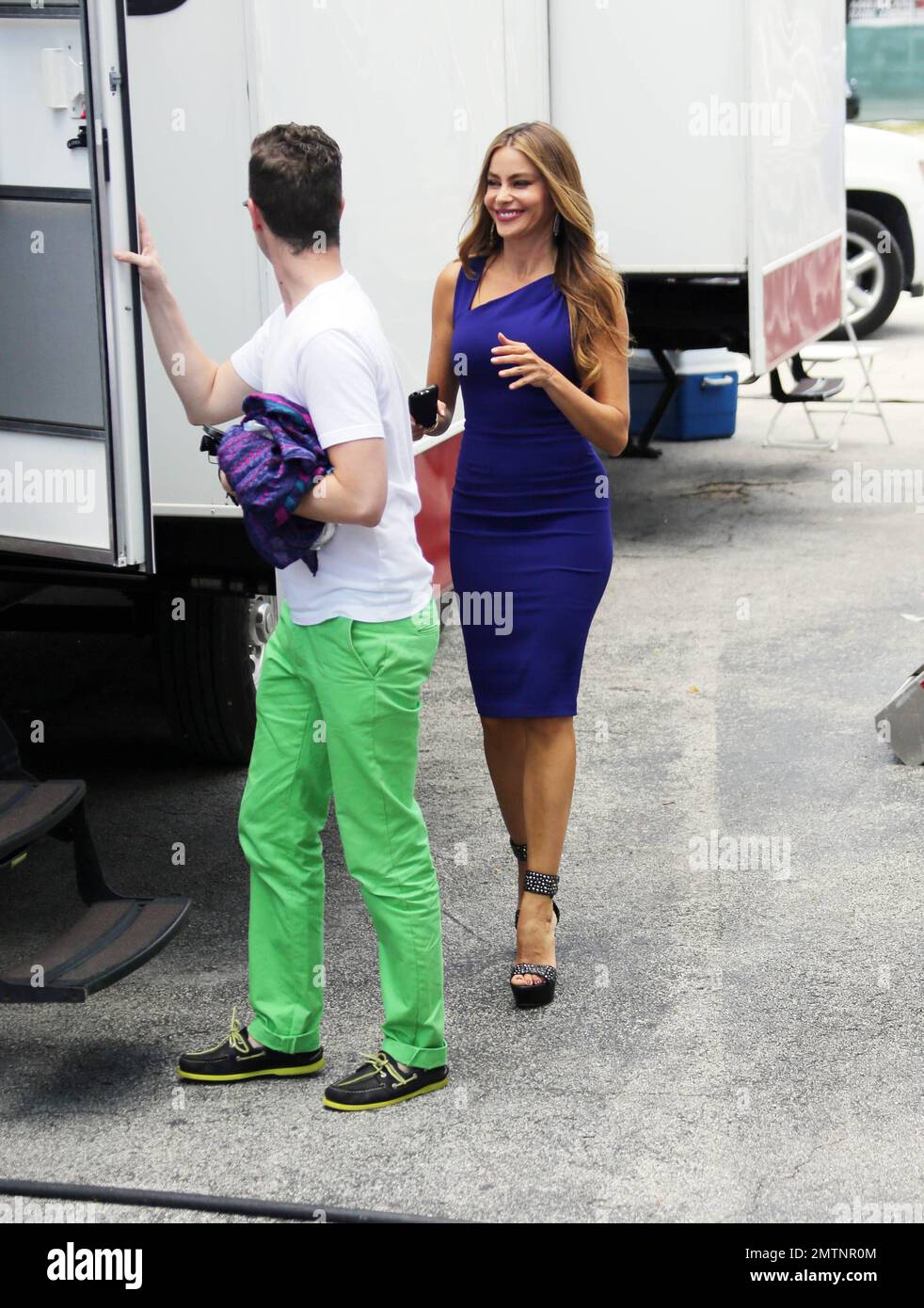 Sofia Vergara shows off her amazing figure in two different form fitting  dresses during a wardrobe change on the set of Chef in Little Havana,  Miami, FL. 10th August Stock Photo 