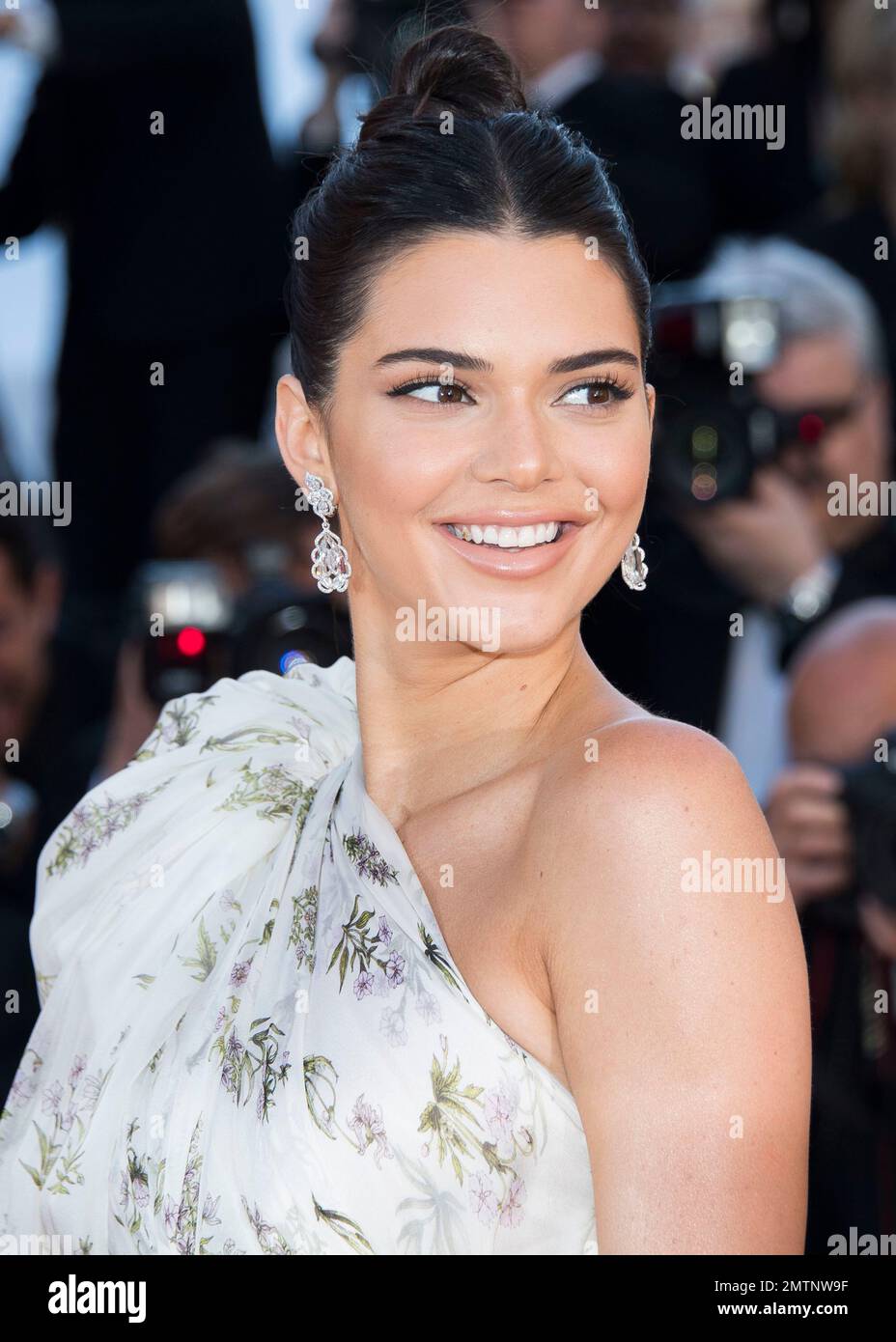 Kendall Jenner poses for photographers upon arrival at the screening of