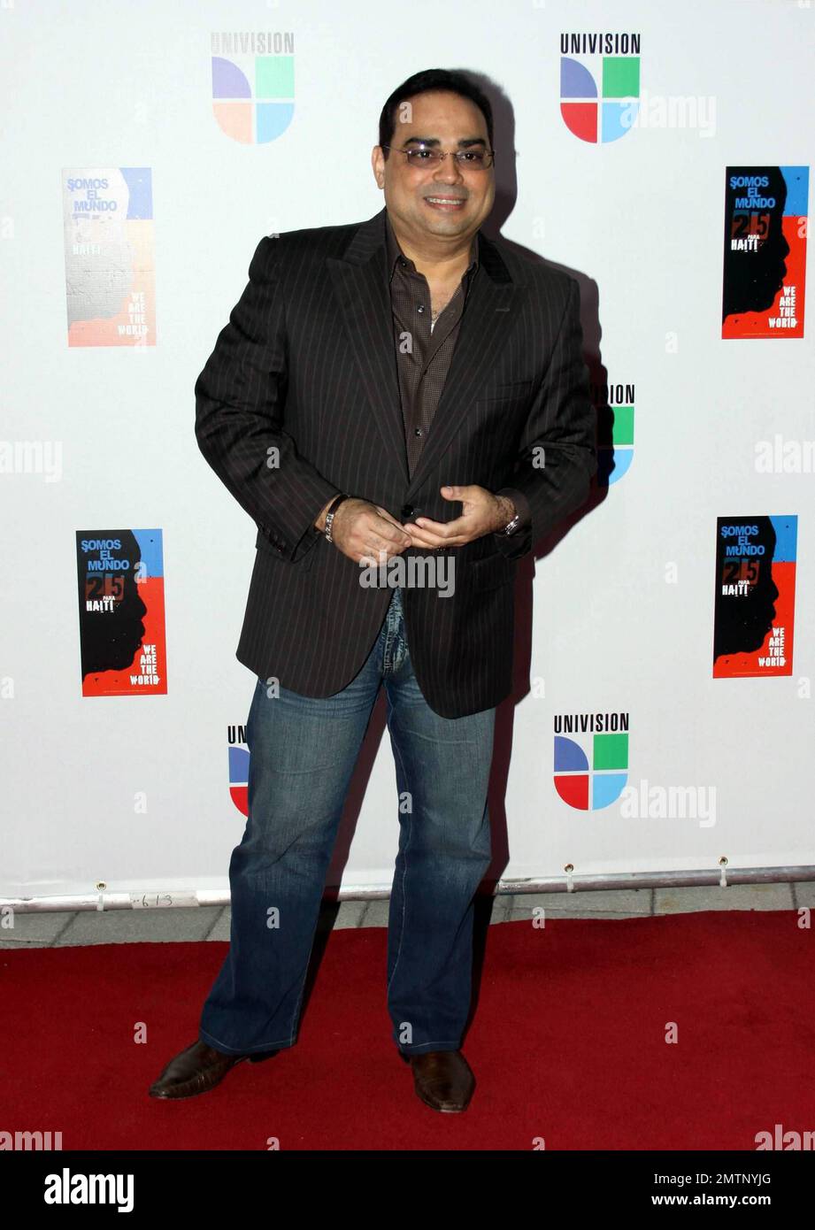 Gilberto Santa Rosa at the epic recording of 'Somos El Mundo,' the Spanish-language version of 'We Are the World.' Adapted into Spanish by Gloria and Emilio Estefan, the song was recorded with the blessings of Lionel Richie and Michael Jackson's estate. Proceeds benefit Haitian earthquake victims. Miami, FL. 2/19/10.   . Stock Photo