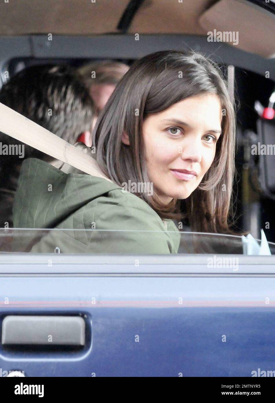 Katie Holmes brings along baby Suri, who seems to be getting bigger every day, as she arrives on the set of her new film 'Son of No One.' Holmes looked to be having a great time on the job as she filmed a scene with Channing Tatum during the shoot in New York, NY. 4/9/10. Stock Photo