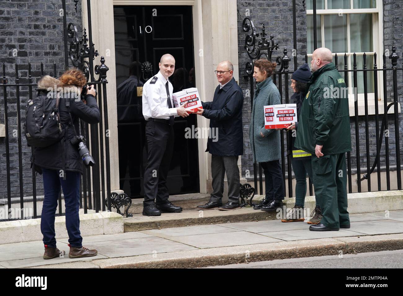 Paul Nowak, general secretary of the Trades Union Congress (TUC), is joined by a representative of the Fire Brigades Union and the NHS Ambulance Service as they hand in a mass petition against the Government's controversial plans for a new law on minimum service levels during strikes to 10 Downing Street, London. Picture date: Wednesday February 1, 2023. Stock Photo