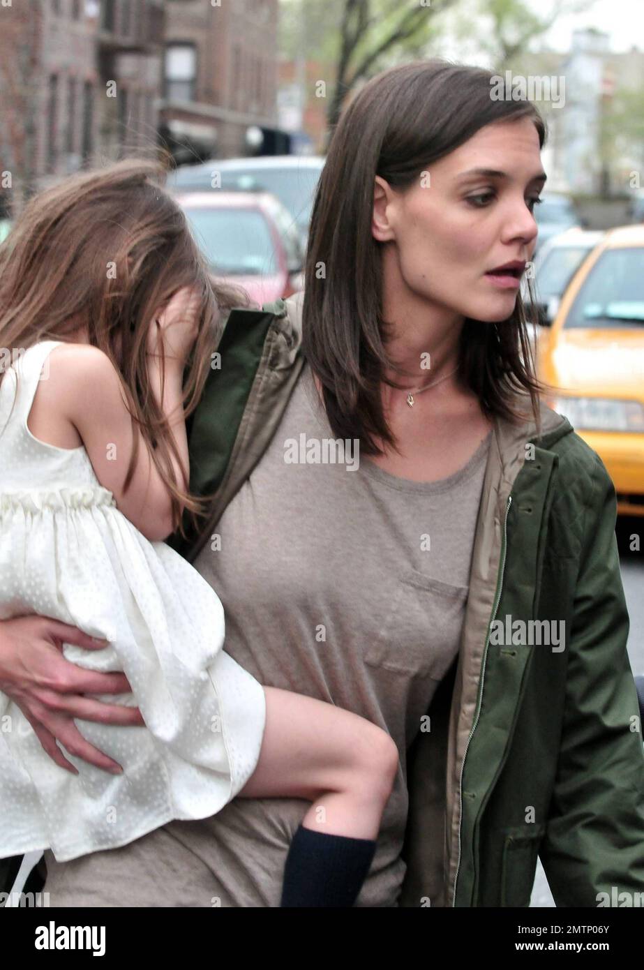 Katie Holmes brings along baby Suri, who seems to be getting bigger every day, as she arrives on the set of her new film 'Son of No One.' Holmes looked to be having a great time on the job as she filmed a scene with Channing Tatum during the shoot in New York, NY. 4/9/10.   . Stock Photo