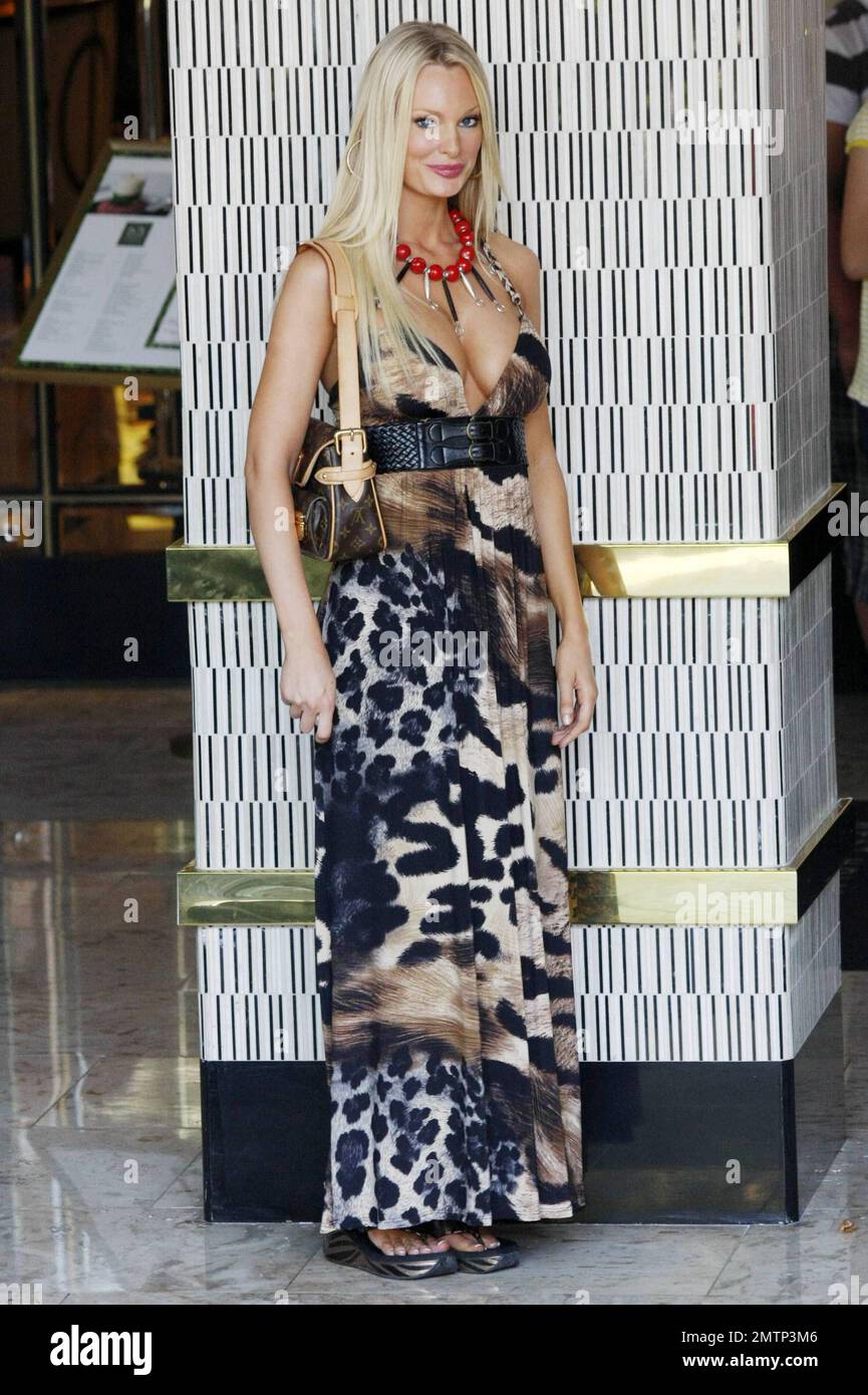 Australian model and actress Sophie Turner pays a valet and poses for photographers as she