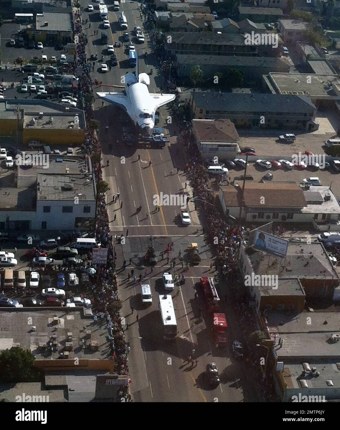 The Space Shuttle Endeavour is moved through the streets of Los Angeles ...