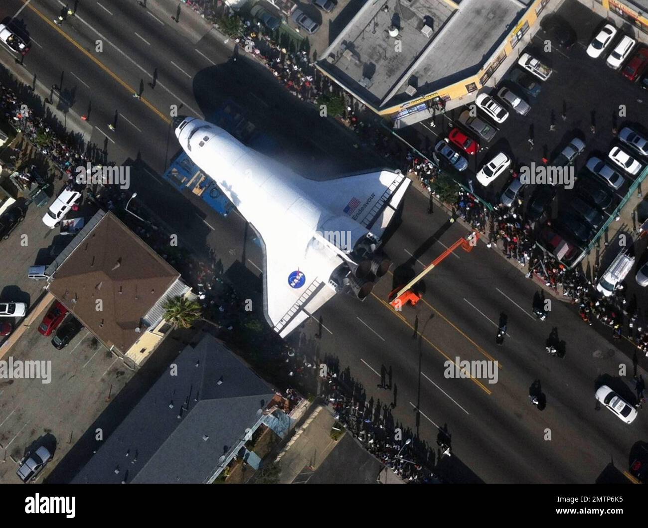 The Space Shuttle Endeavour is moved through the streets of Los Angeles ...