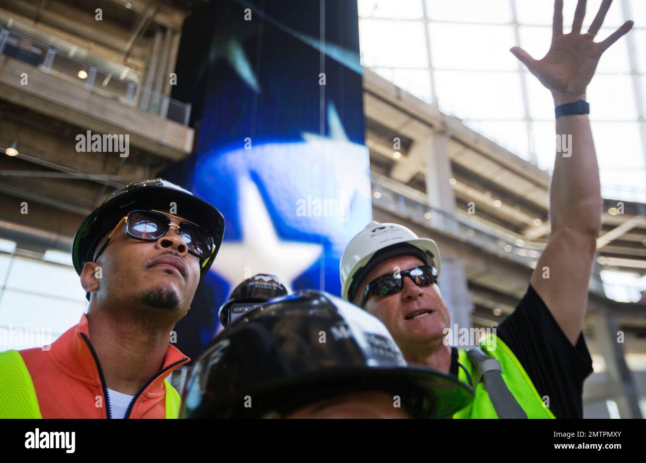 Rapper T.I. looks out from a suite during a tour of Mercedes-Benz Stadium,  the new stadium for the Atlanta Falcons NFL football team under  construction in Atlanta, Tuesday, April 25, 2017. (AP